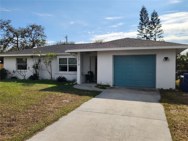 ranch-style house with a front yard and a garage