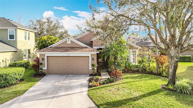 view of front of house featuring a front yard, driveway, an attached garage, and stucco siding