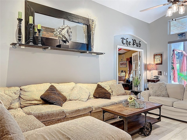 living room with ceiling fan and wood finished floors