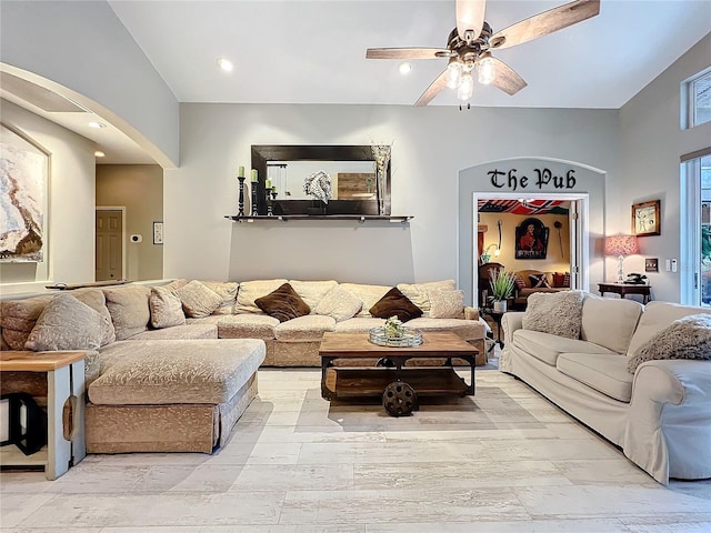 living room featuring a ceiling fan and recessed lighting