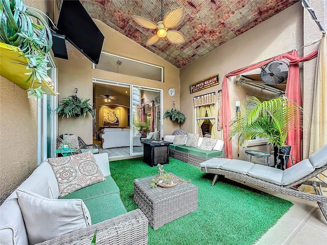 view of patio with a ceiling fan and an outdoor living space