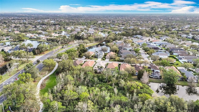 bird's eye view with a water view and a residential view