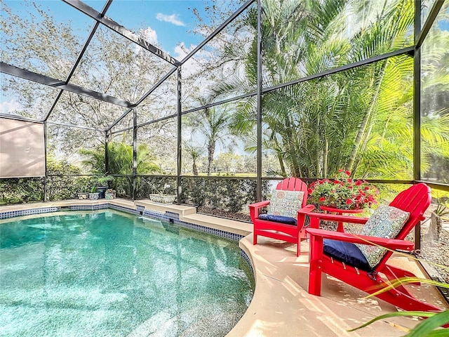 pool with a patio area and a lanai