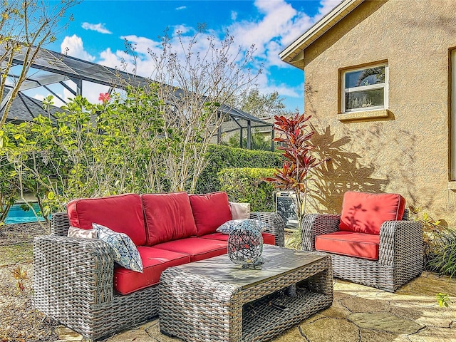 view of patio with a lanai and an outdoor living space