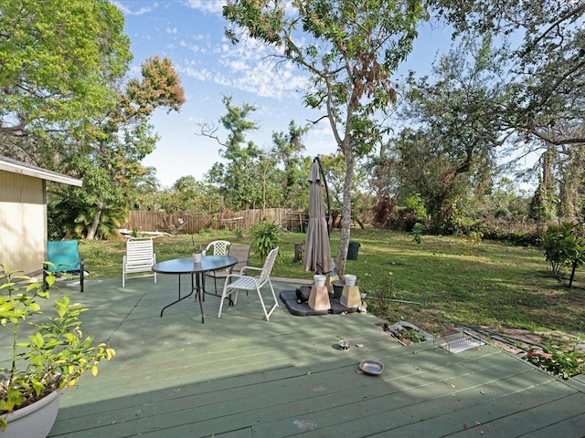 wooden deck with a yard