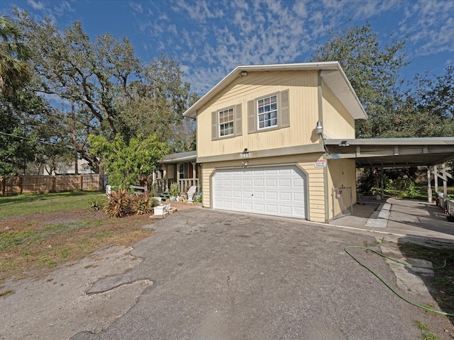 view of front of home featuring a carport and a garage