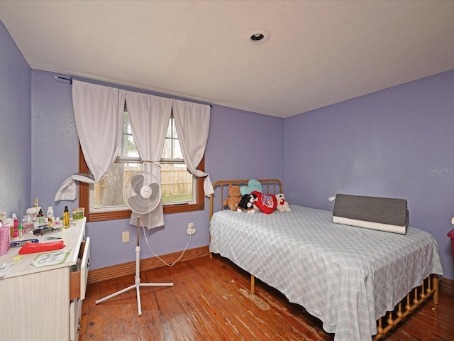 bedroom featuring wood-type flooring