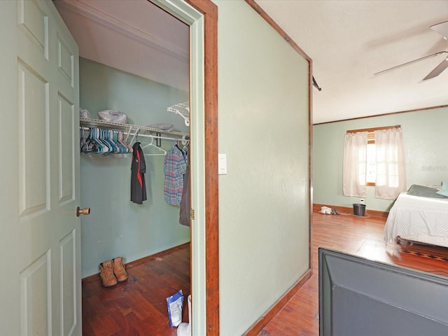 bedroom featuring hardwood / wood-style flooring, a closet, and ceiling fan