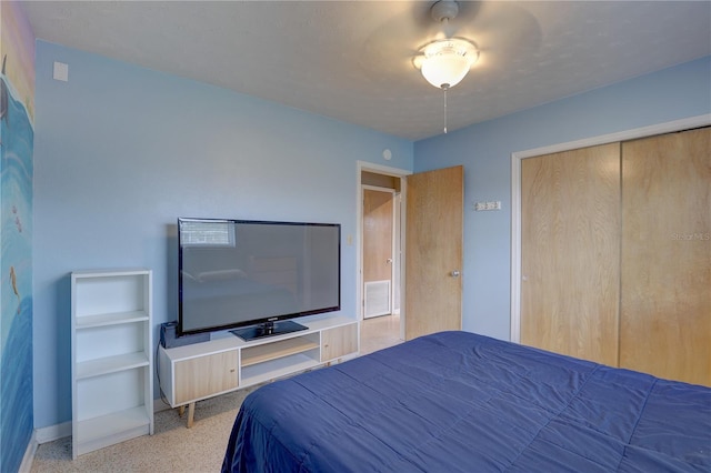 unfurnished bedroom featuring light colored carpet and a closet