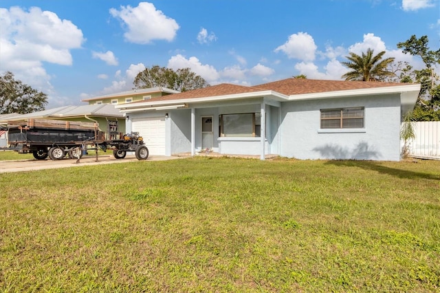 view of front facade featuring a front yard and a garage