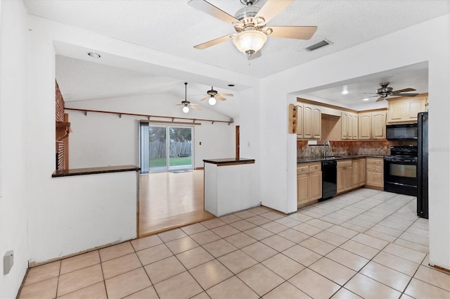 kitchen featuring tasteful backsplash, lofted ceiling, black appliances, a textured ceiling, and light tile patterned floors