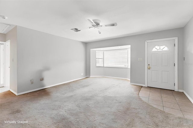 entryway with ceiling fan and light colored carpet