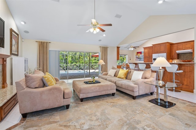 living room featuring high vaulted ceiling and ceiling fan