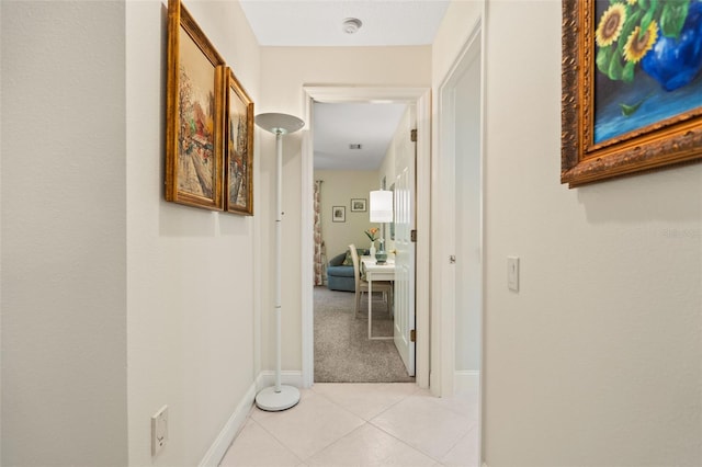 corridor featuring light tile patterned floors