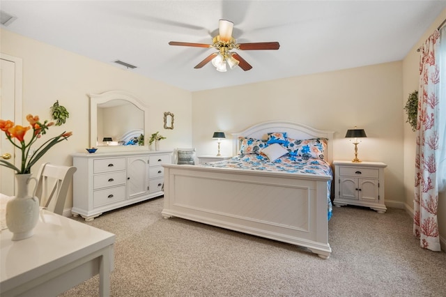 bedroom featuring ceiling fan and light carpet