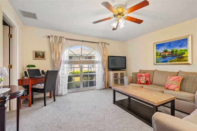 living room featuring ceiling fan and light carpet