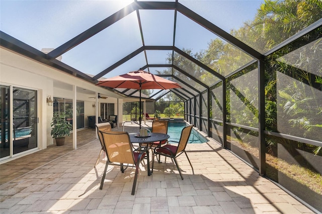 sunroom featuring a pool and vaulted ceiling