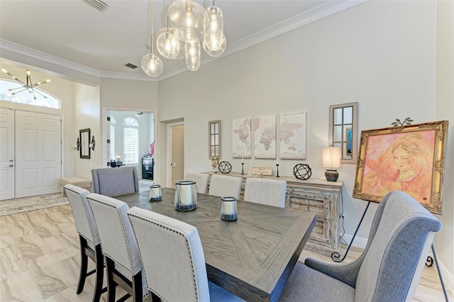 dining space featuring a notable chandelier and ornamental molding