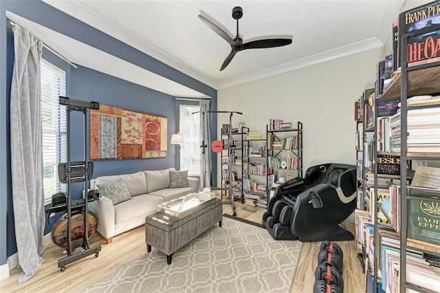 living room featuring plenty of natural light, hardwood / wood-style floors, and ornamental molding