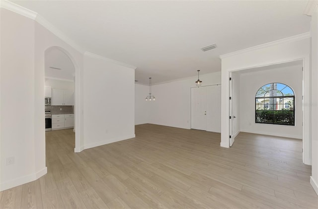 interior space with ornamental molding and light wood-type flooring