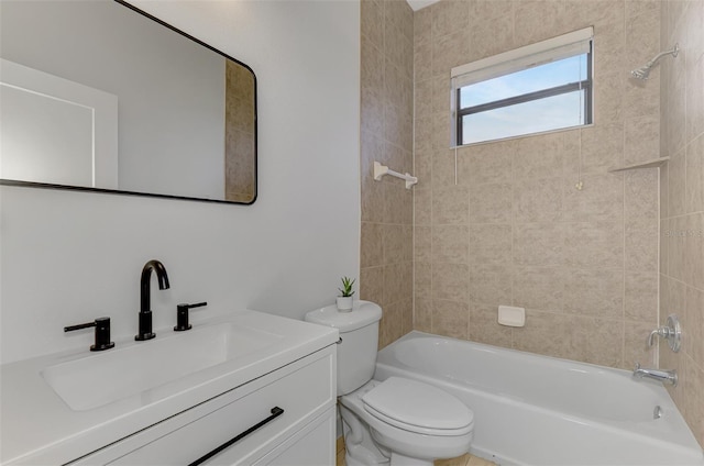 full bathroom featuring vanity, toilet, and tiled shower / bath combo