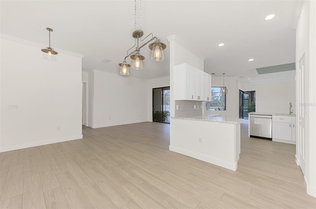 kitchen featuring white cabinetry, decorative backsplash, kitchen peninsula, and dishwasher