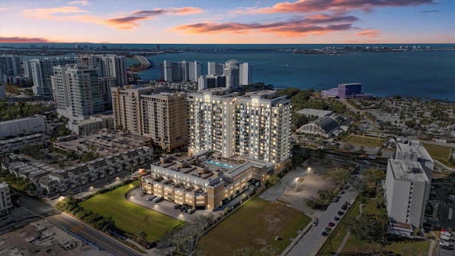 aerial view at dusk with a water view