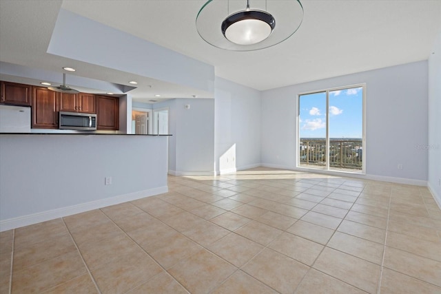 unfurnished living room with light tile patterned flooring