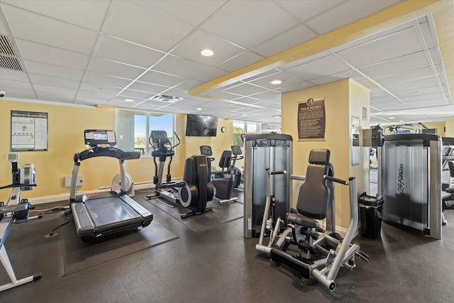 workout area featuring a drop ceiling