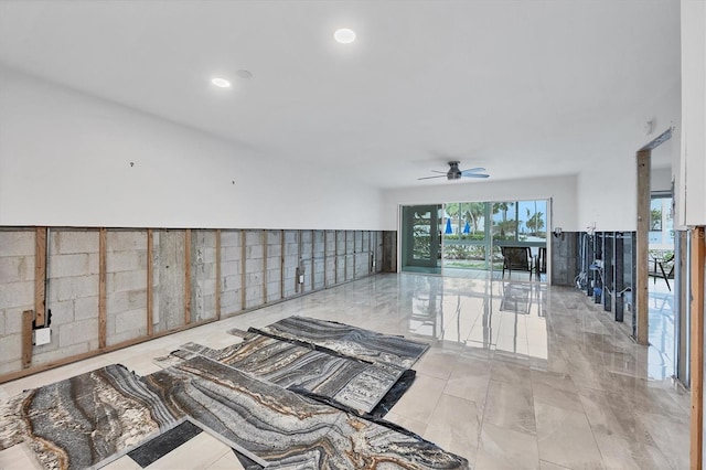 empty room with a ceiling fan and recessed lighting