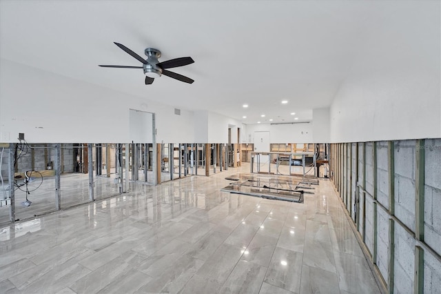 interior space with ceiling fan and visible vents