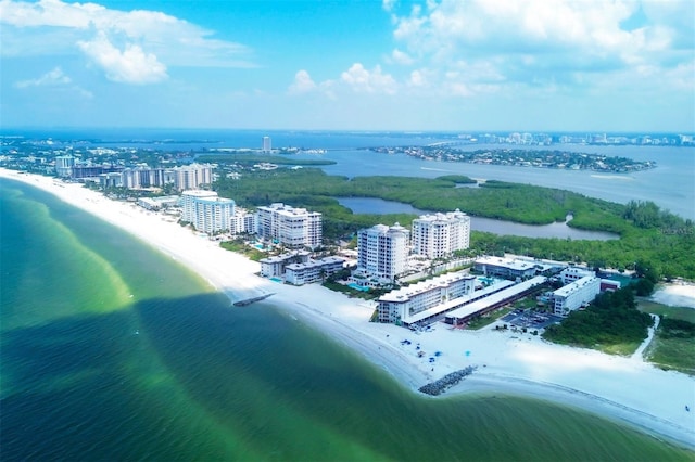 bird's eye view with a water view, a view of city, and a beach view