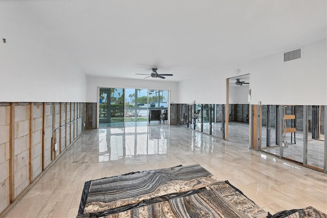 interior space featuring ceiling fan and visible vents