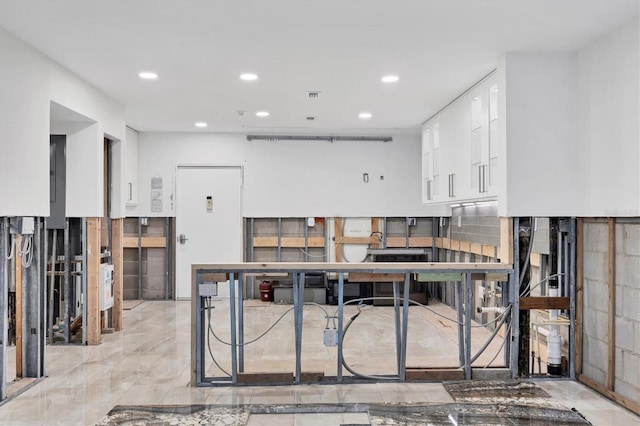 kitchen featuring visible vents, white cabinetry, and recessed lighting