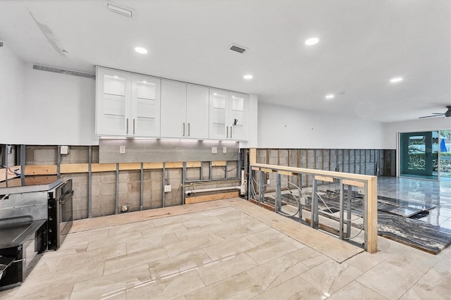 interior space featuring ceiling fan, visible vents, and recessed lighting