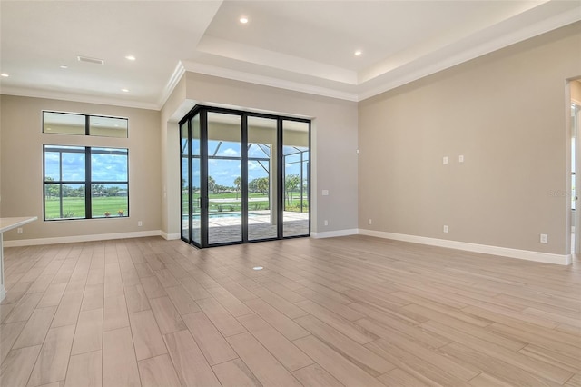 10612 Nicklaus Ct, Englewood, FL 34223 - unfurnished room with light wood finished floors, baseboards, recessed lighting, and crown molding