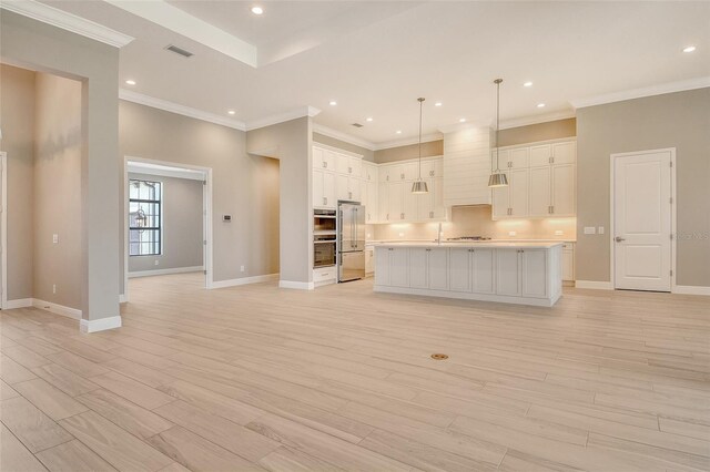 10612 Nicklaus Ct, Englewood, FL 34223 - kitchen featuring high quality fridge, baseboards, open floor plan, light wood-style flooring, and recessed lighting