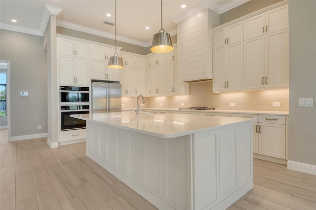 10612 Nicklaus Ct, Englewood, FL 34223 - kitchen featuring stainless steel appliances, crown molding, white cabinetry, light countertops, and backsplash