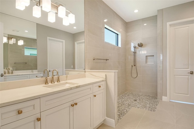 10612 Nicklaus Ct, Englewood, FL 34223 - bathroom featuring a walk in shower, vanity, tile patterned floors, and recessed lighting