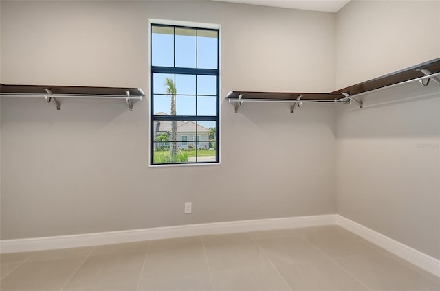 10612 Nicklaus Ct, Englewood, FL 34223 - spacious closet with tile patterned flooring
