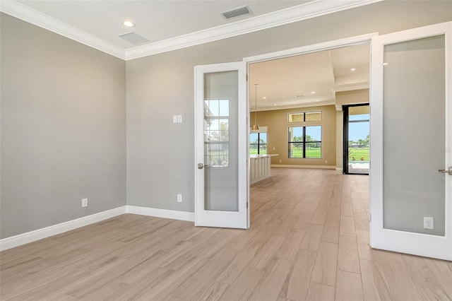 10612 Nicklaus Ct, Englewood, FL 34223 - unfurnished room featuring light wood-type flooring, crown molding, baseboards, french doors, and recessed lighting