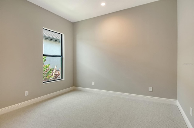 10612 Nicklaus Ct, Englewood, FL 34223 - unfurnished room with light colored carpet, baseboards, and recessed lighting