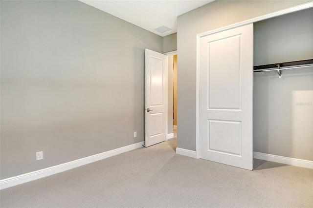 10612 Nicklaus Ct, Englewood, FL 34223 - unfurnished bedroom featuring light colored carpet, a closet, and baseboards