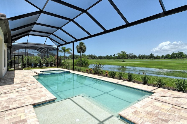 10612 Nicklaus Ct, Englewood, FL 34223 - view of pool featuring a patio area, a pool with connected hot tub, a water view, and glass enclosure