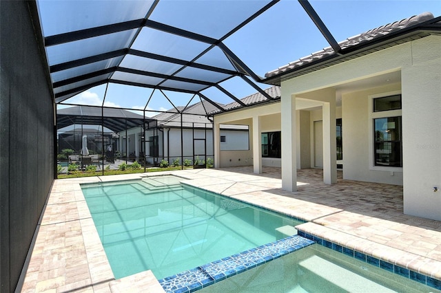 10612 Nicklaus Ct, Englewood, FL 34223 - view of swimming pool with a pool with connected hot tub, a patio area, and a lanai
