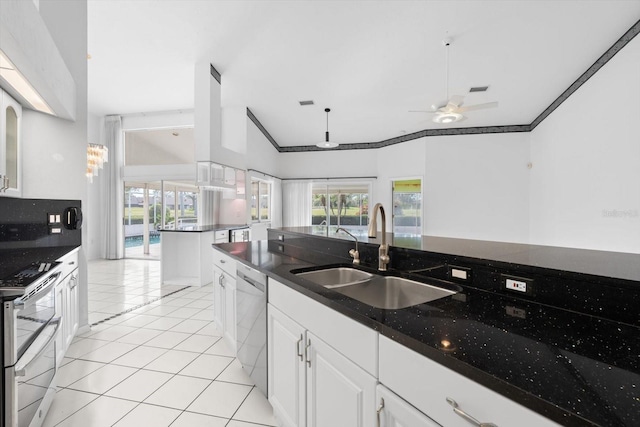 kitchen with ceiling fan, sink, dishwasher, white cabinets, and light tile patterned flooring