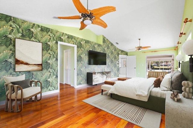 bedroom with hardwood / wood-style floors, ceiling fan, and lofted ceiling