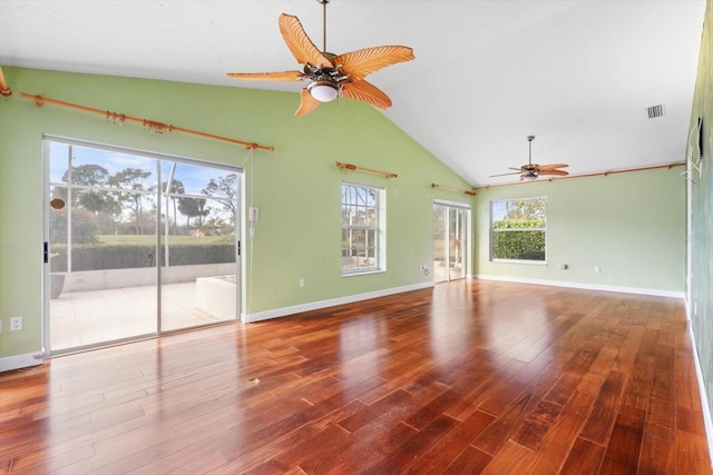 unfurnished living room with ceiling fan, plenty of natural light, wood-type flooring, and lofted ceiling