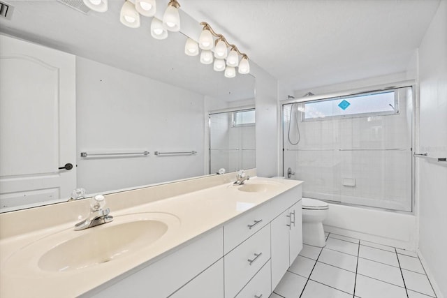 full bathroom with tile patterned flooring, vanity, toilet, and enclosed tub / shower combo