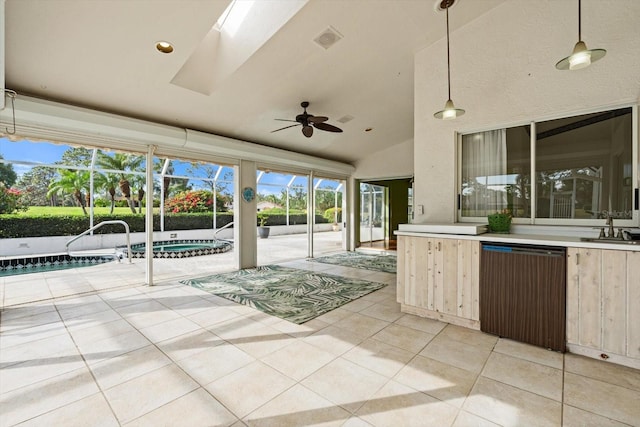 view of patio featuring a jacuzzi, a lanai, ceiling fan, and an outdoor wet bar